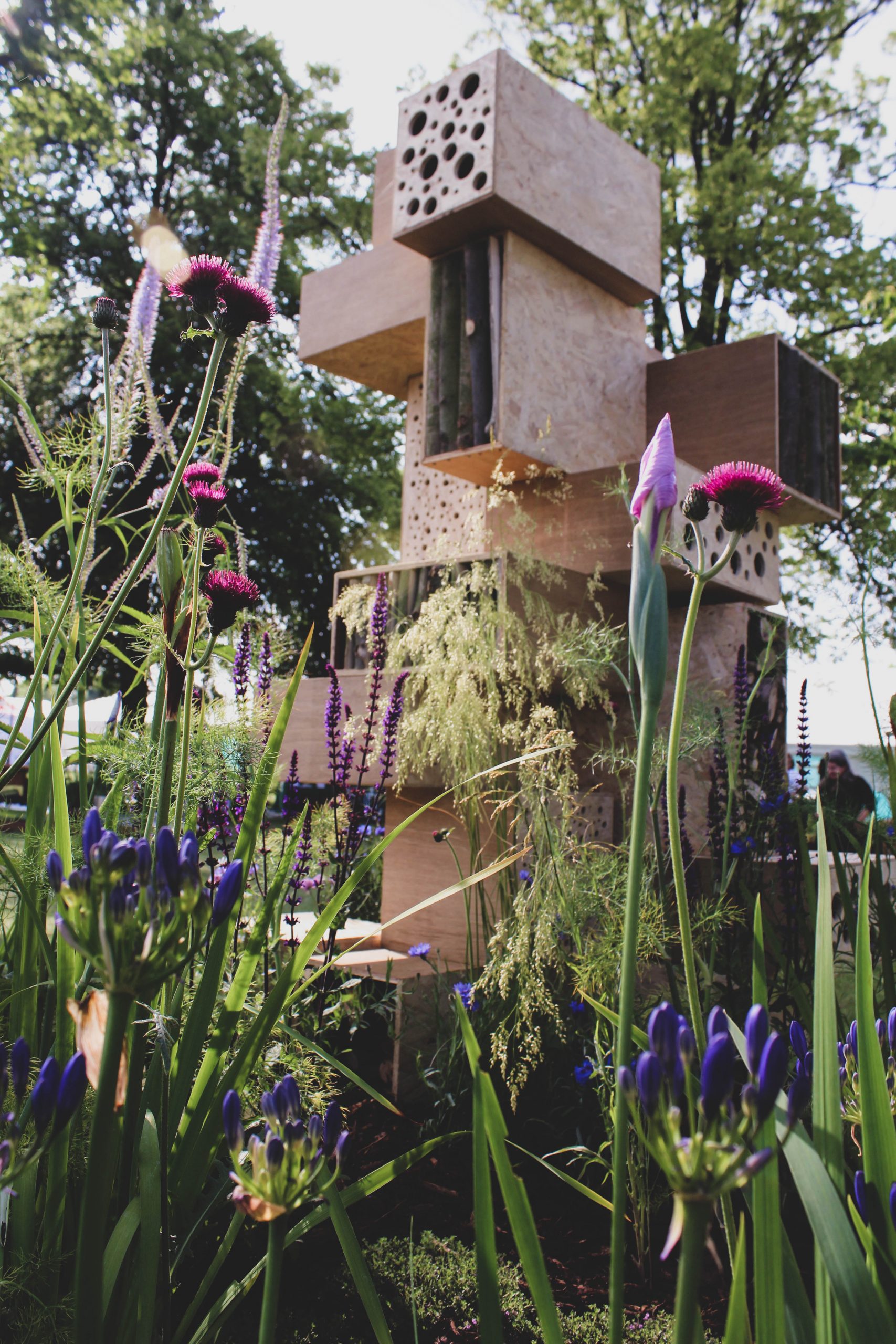 Large bee hotel surrounded by bee-friendly planting at Blenheim Palace Flower Show