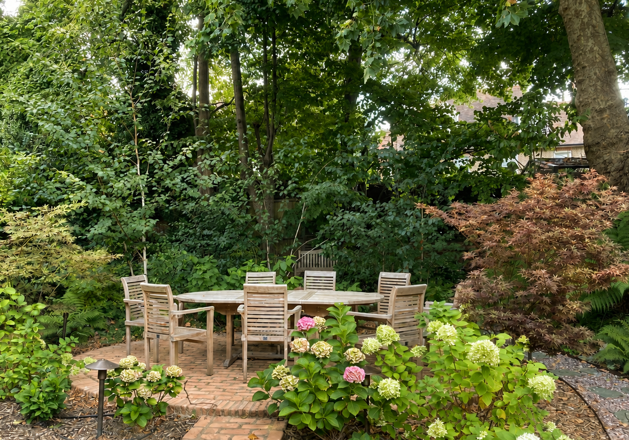 Shared garden dining area in Hampstead surrounded by woodland planting