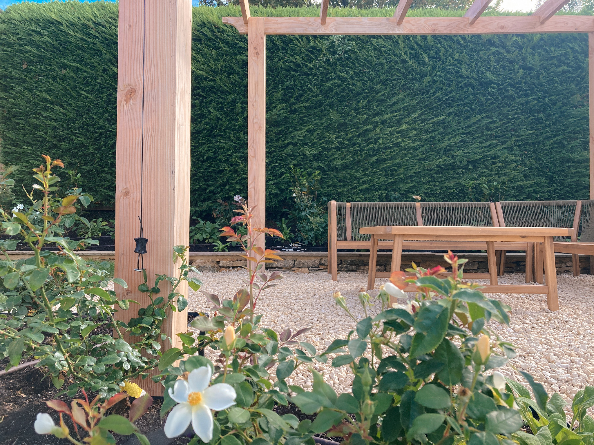 Pergola seating area in a country garden in Chipping Norton, Oxfordshire