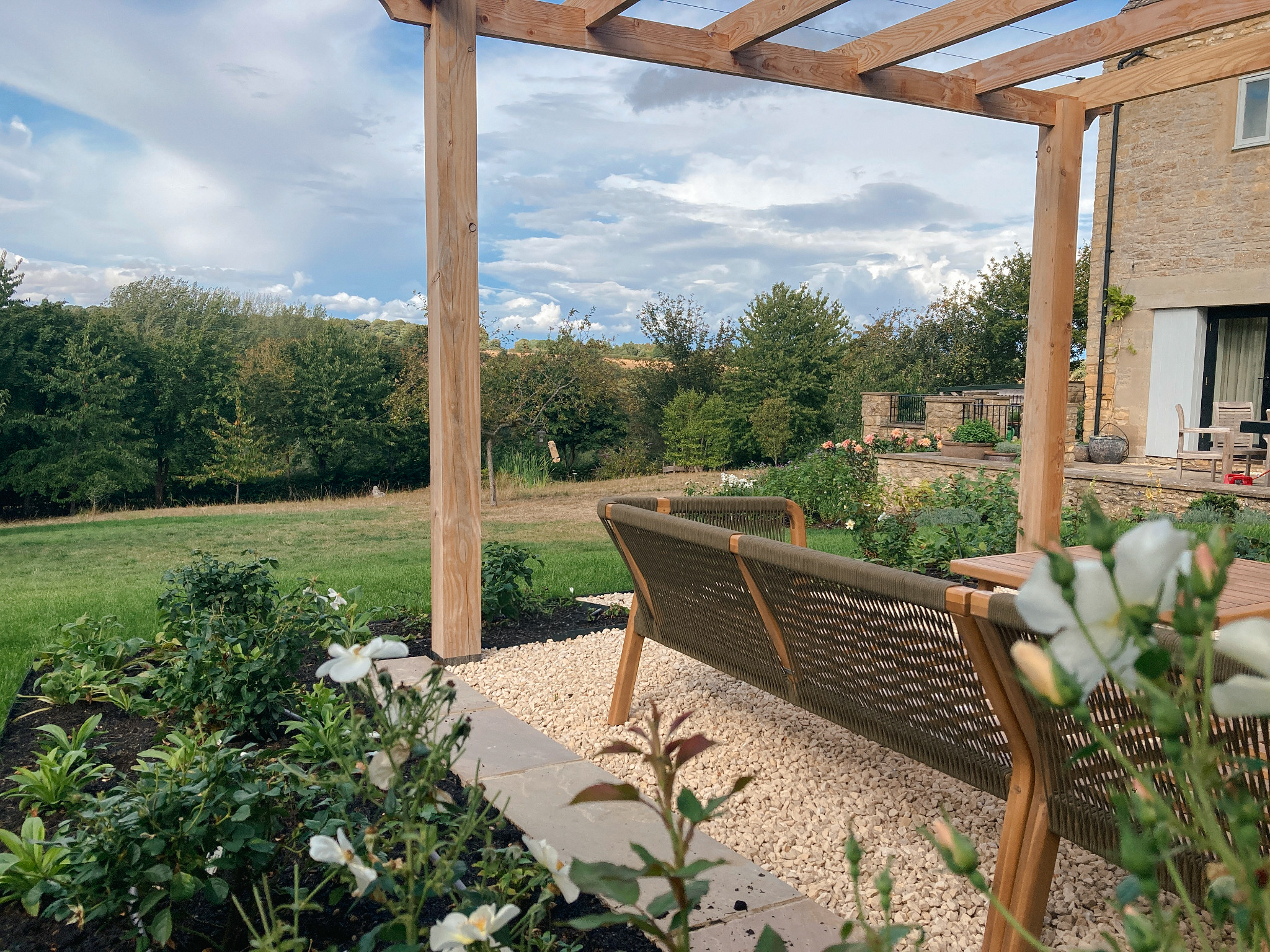 Chipping Norton garden pergola overlooking a large Oxfordshire country landscape